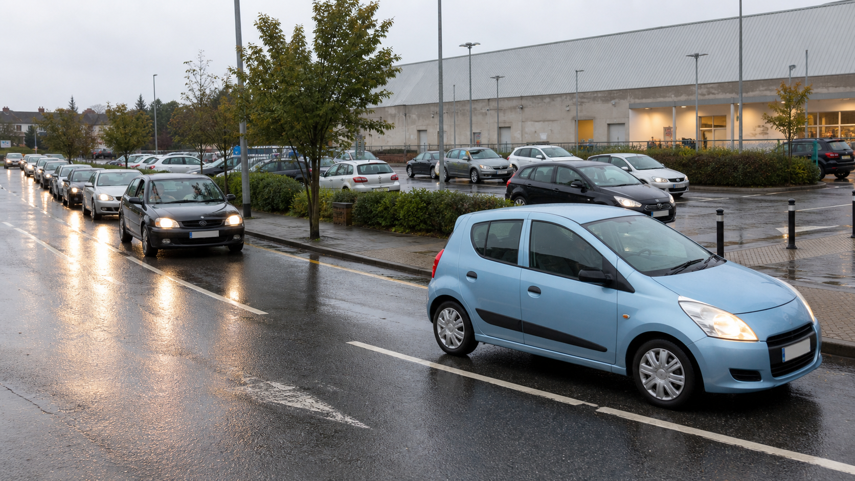 Cars queuing outside an unbranded supermarket car park on a rainy day